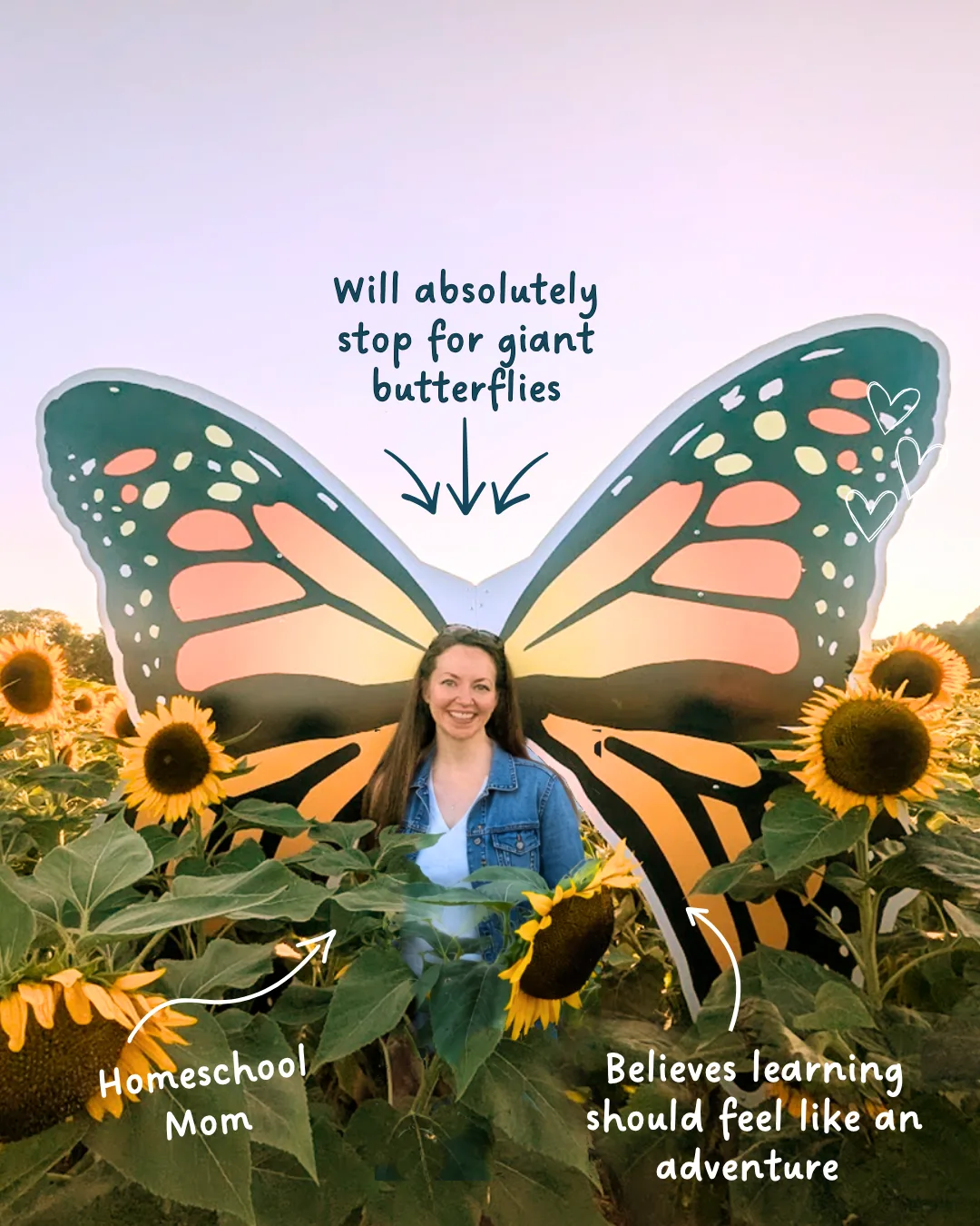 Laela standing among sunflowers in front of giant butterfly wings