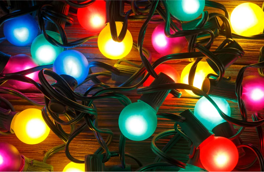 Close up of round vintage Christmas light bulbs on a wood background