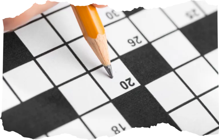 solving black and white crossword puzzle close-up