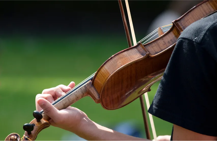 playing violin outdoors